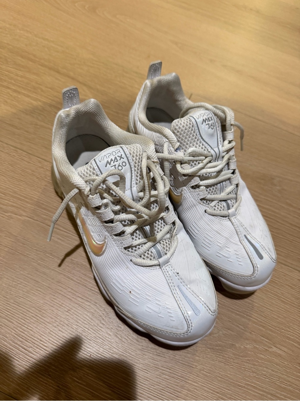 Nike Women's White Sneakers with Gold Swoosh